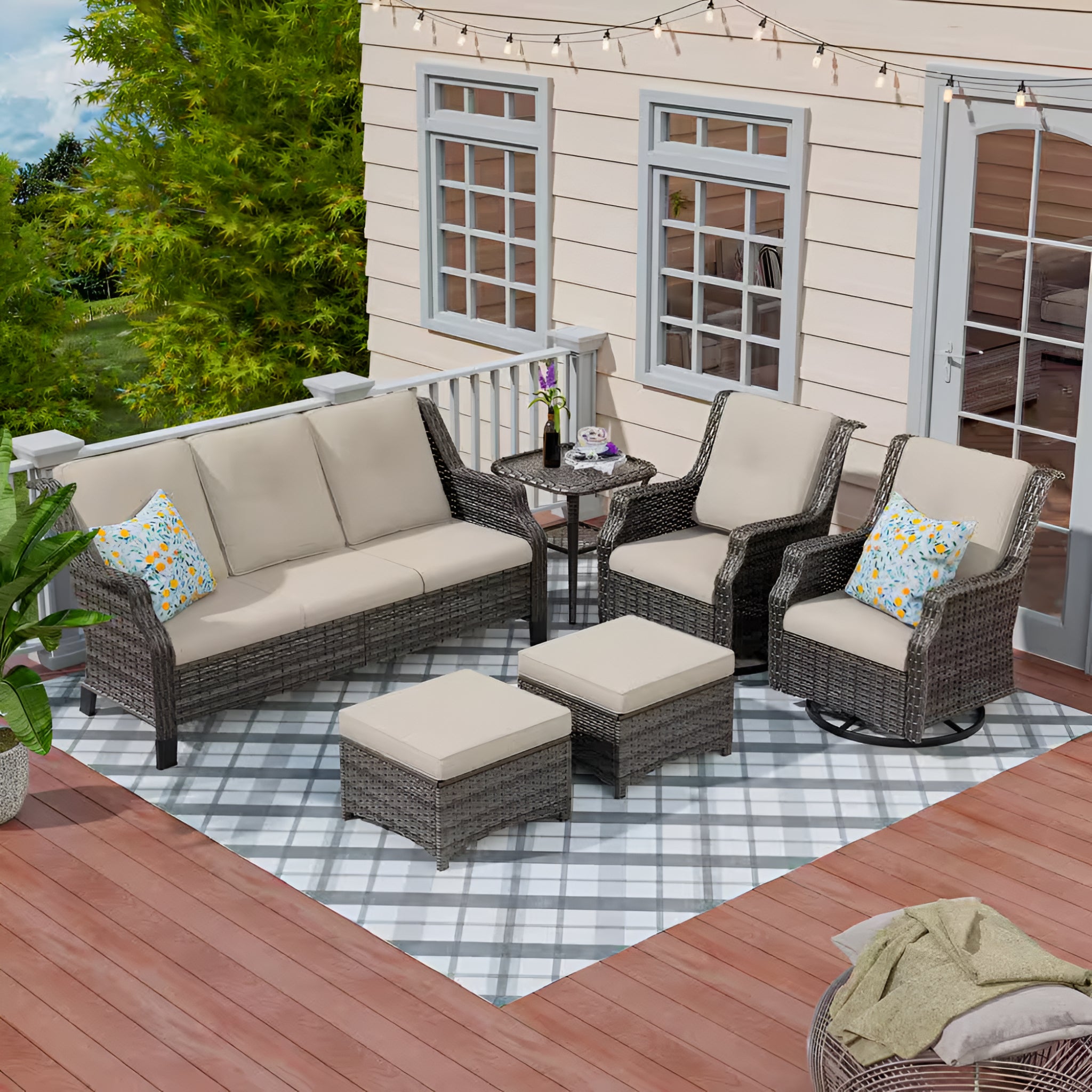 Outdoor patio furniture set with beige cushions on a deck.
